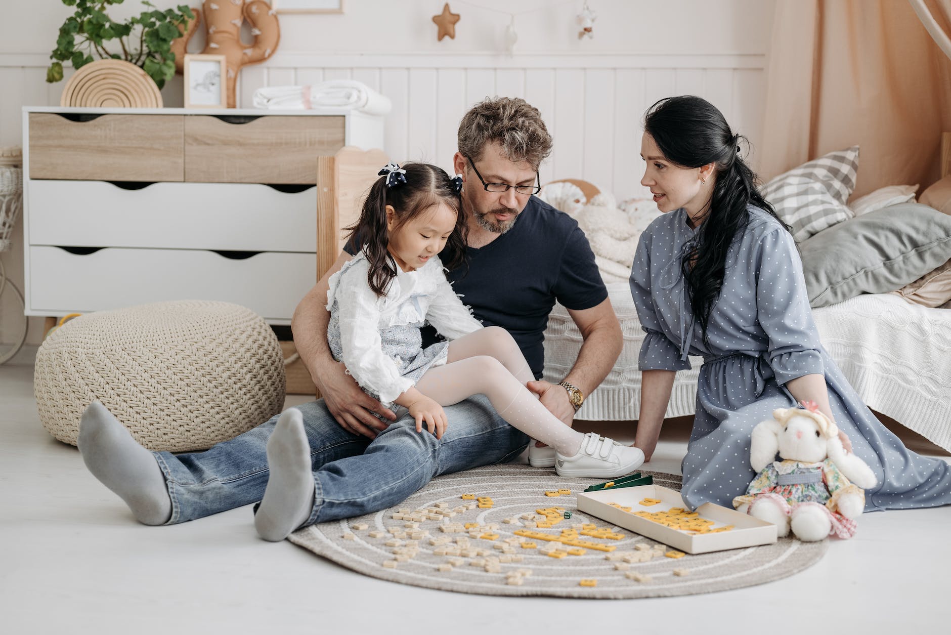 family playing scrabble